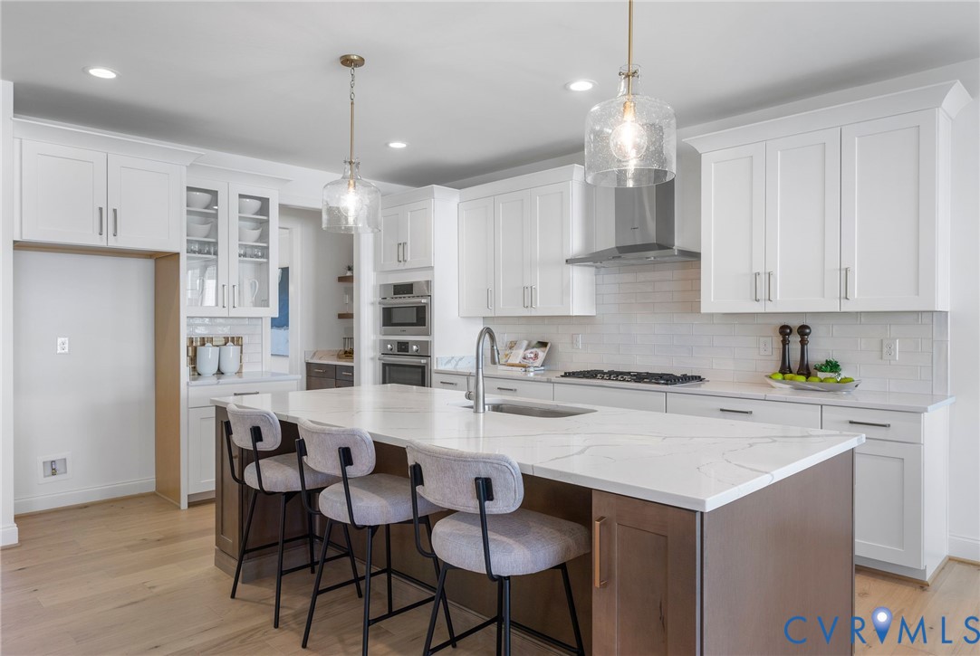 2831 Old Pump Road Henrico, VA 23233 - Photo 12 of 42 a kitchen with cabinets a center island and appliances