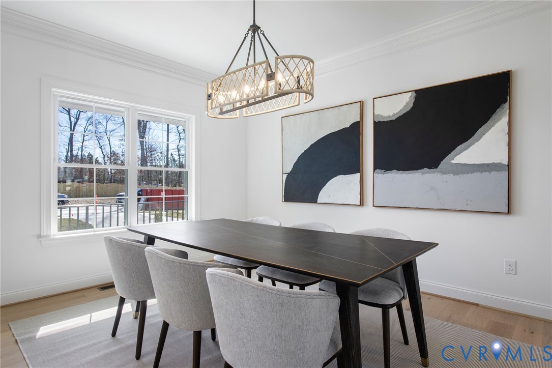 2831 Old Pump Road Henrico, VA 23233 - Photo 18 of 42 a view of a dining room with furniture and wooden floor