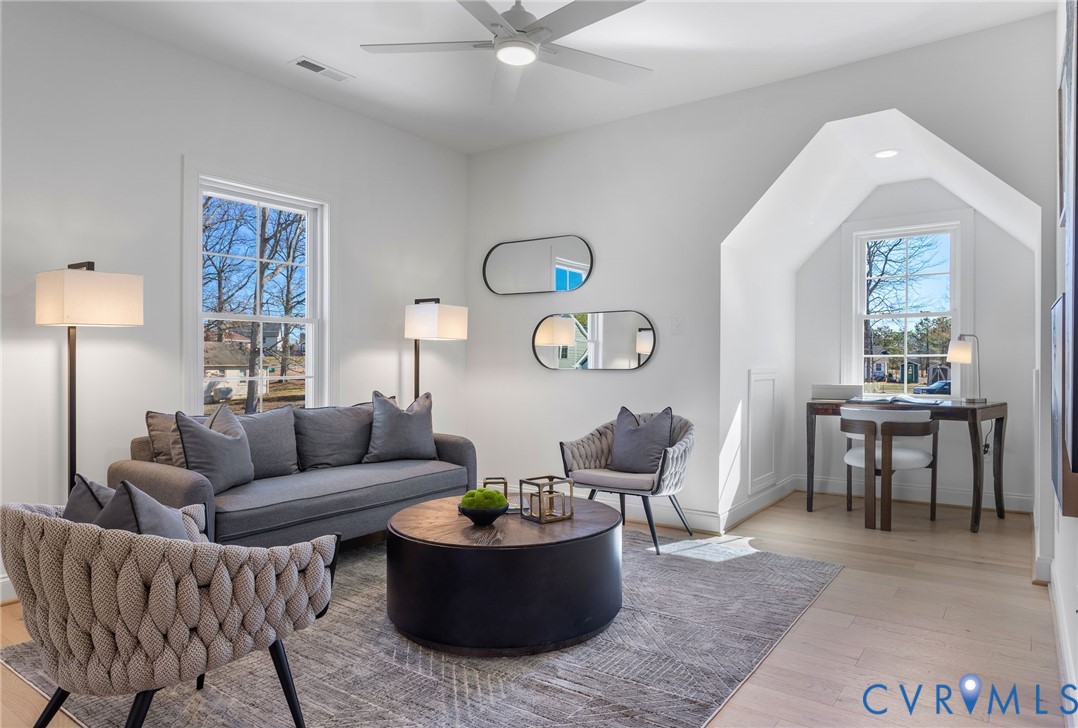 2831 Old Pump Road Henrico, VA 23233 - Photo 23 of 42 a living room with furniture a chandelier and a window