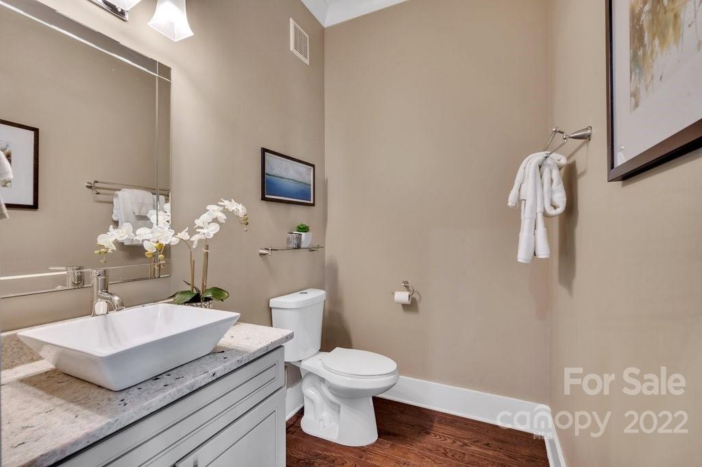 530 McAlway Road Charlotte, NC 28211 - Photo 13 of 36 a bathroom with a sink a toilet and a mirror