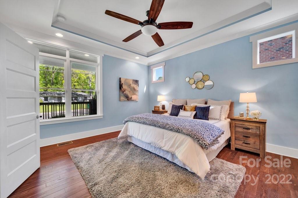 530 McAlway Road Charlotte, NC 28211 - Photo 15 of 36 a bedroom with a bed painting on wall and a large window