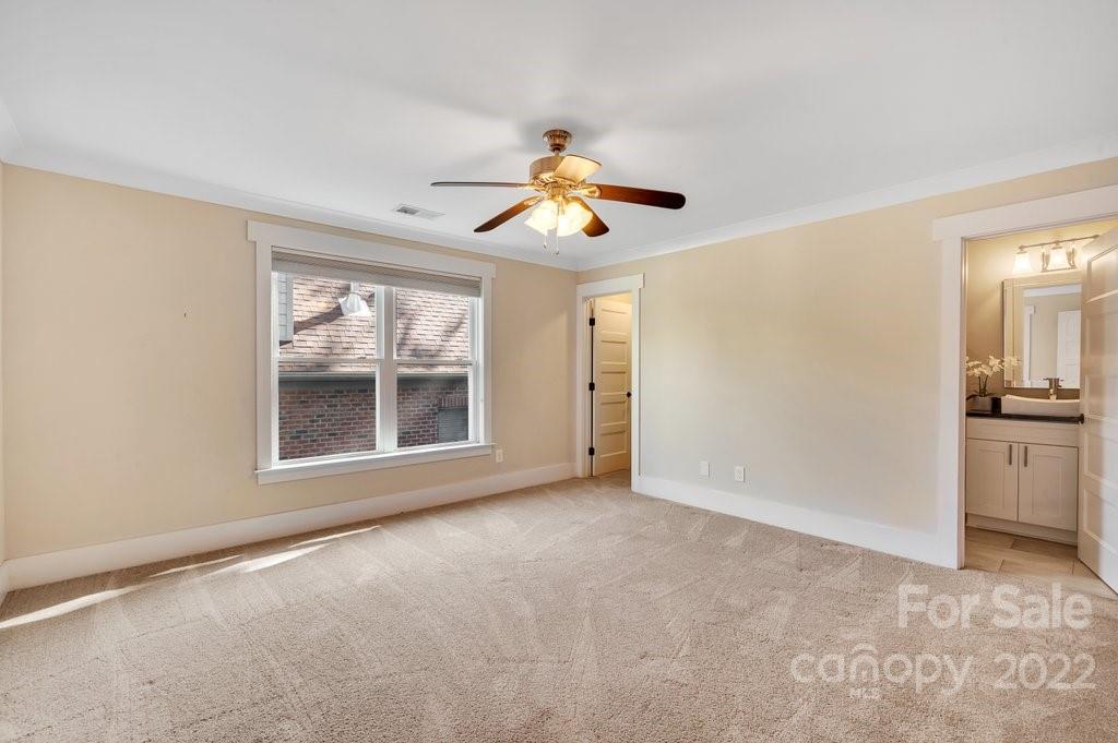 530 McAlway Road Charlotte, NC 28211 - Photo 25 of 36 a view of a big room with windows and chandelier fan