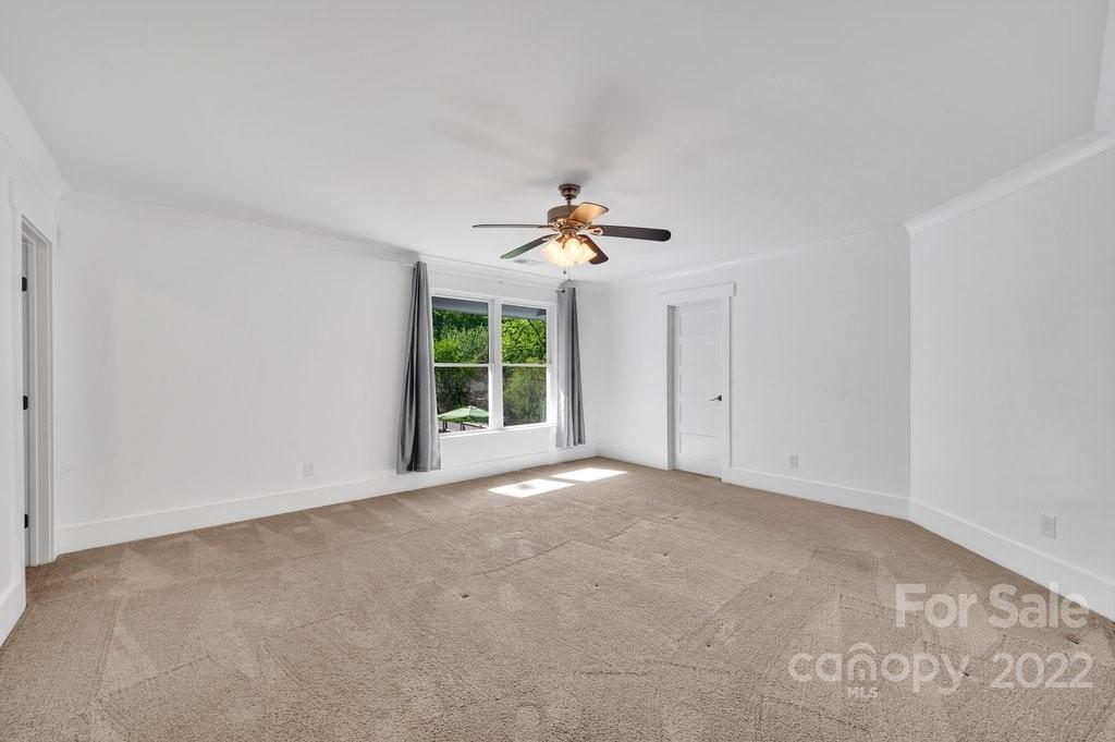 530 McAlway Road Charlotte, NC 28211 - Photo 29 of 36 a view of an empty room with a ceiling fan