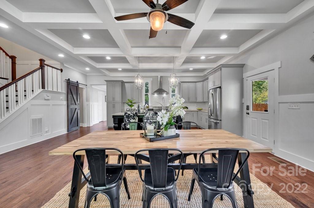 530 McAlway Road Charlotte, NC 28211 - Photo 8 of 36 a view of a dining room with furniture and wooden floor