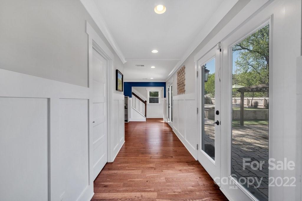 530 McAlway Road Charlotte, NC 28211 - Photo 10 of 36 a view of a hallway with wooden floor and staircase