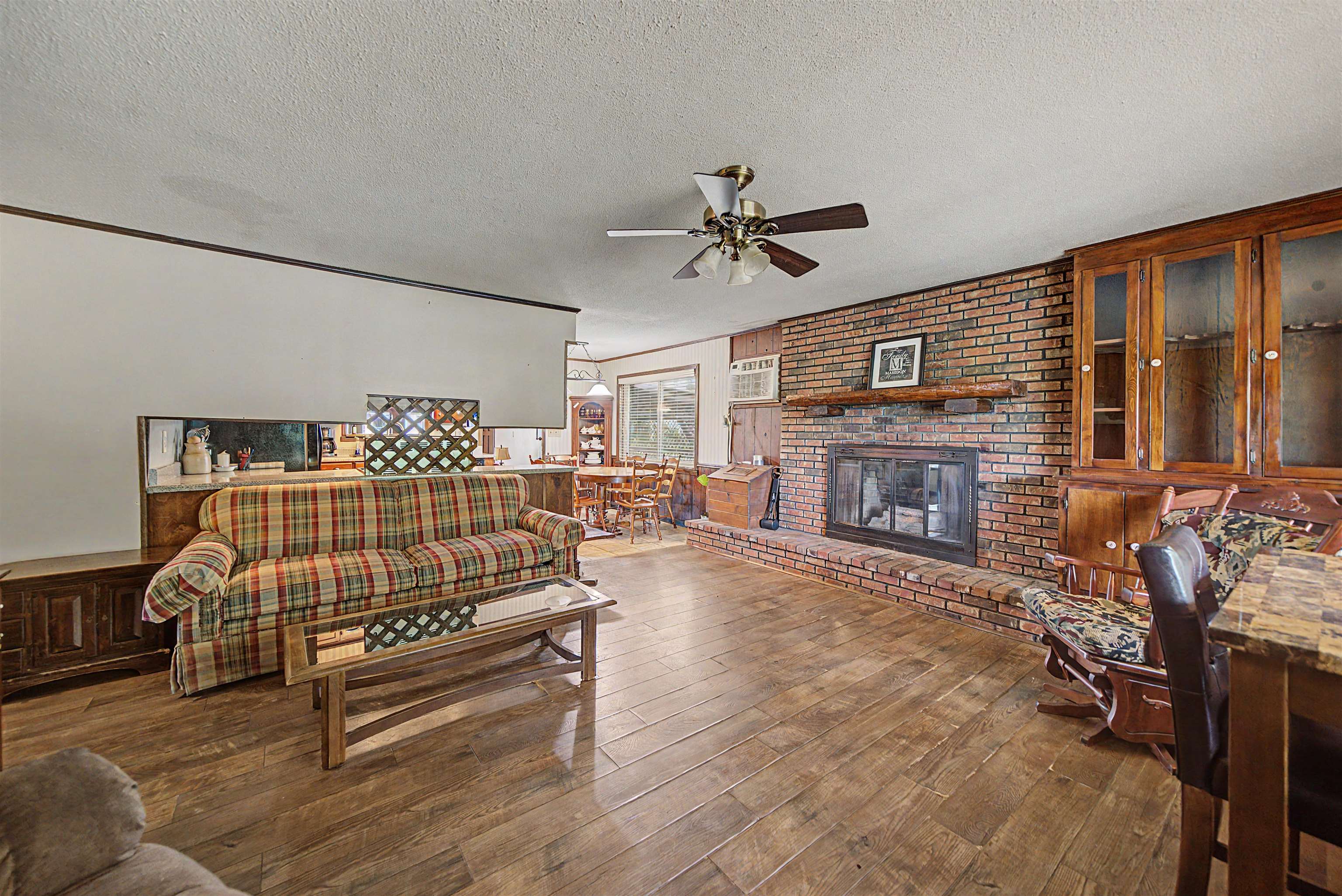 12 Baker Road Selmer, TN 38375 - Photo 14 of 28 a bedroom with furniture and a fireplace