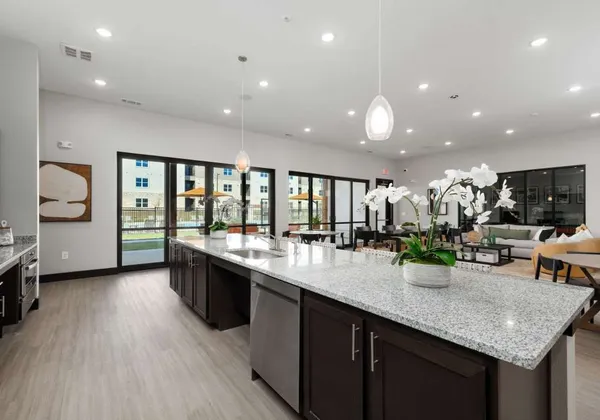 a kitchen with lots of counter space and glass door