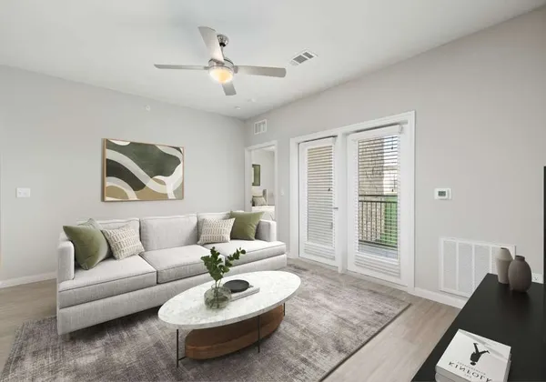 a living room with furniture and a large window