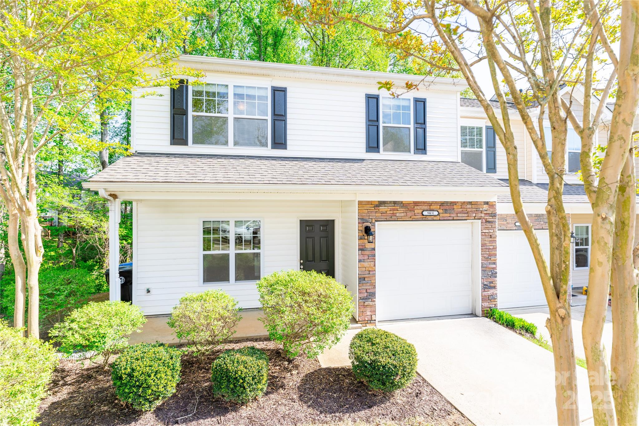 162 Limerick Road, Unit C Mooresville, NC 28115 - Photo 1 of 45 a front view of a house with garden