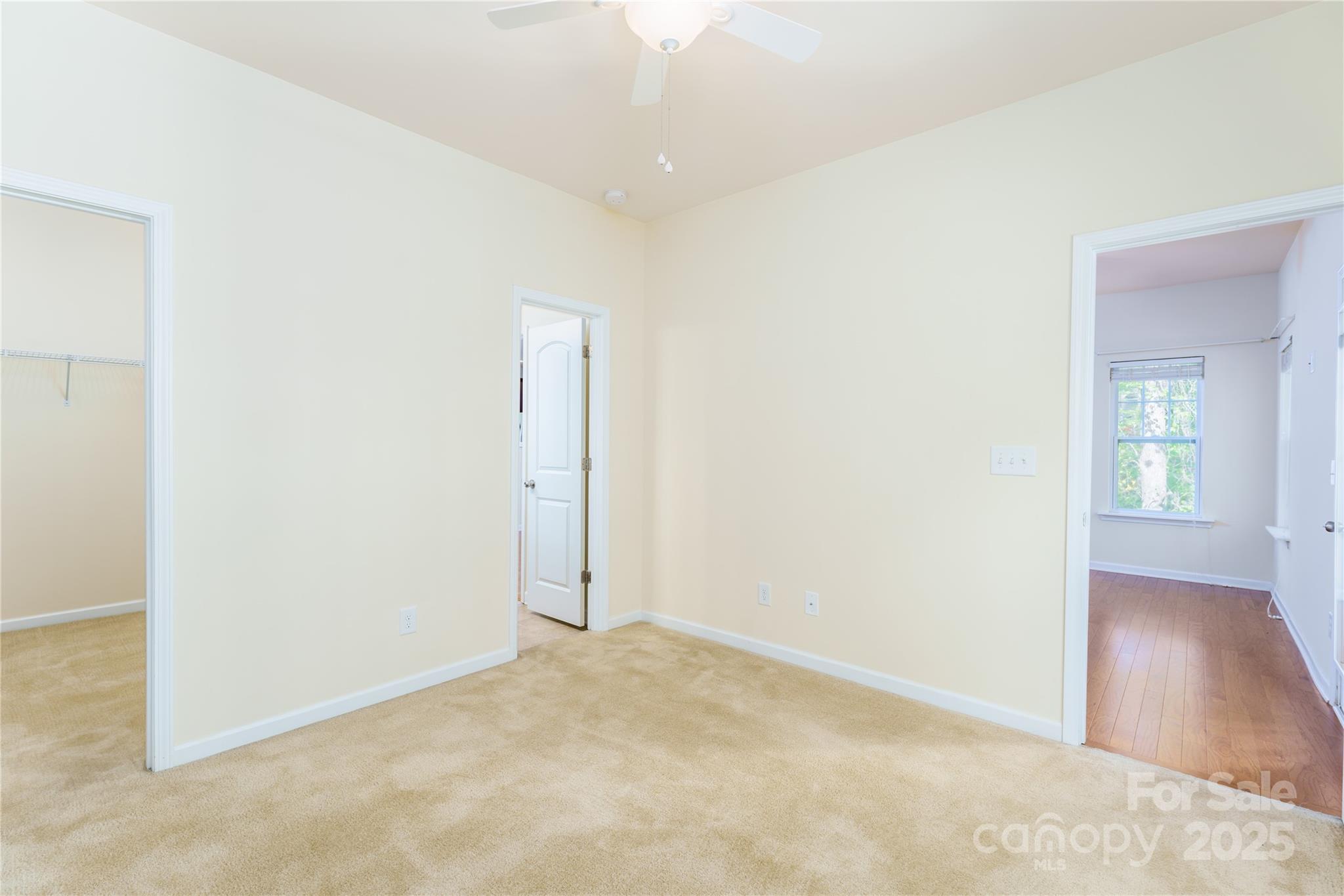 162 Limerick Road, Unit C Mooresville, NC 28115 - Photo 12 of 45 an empty room with wooden floor and windows
