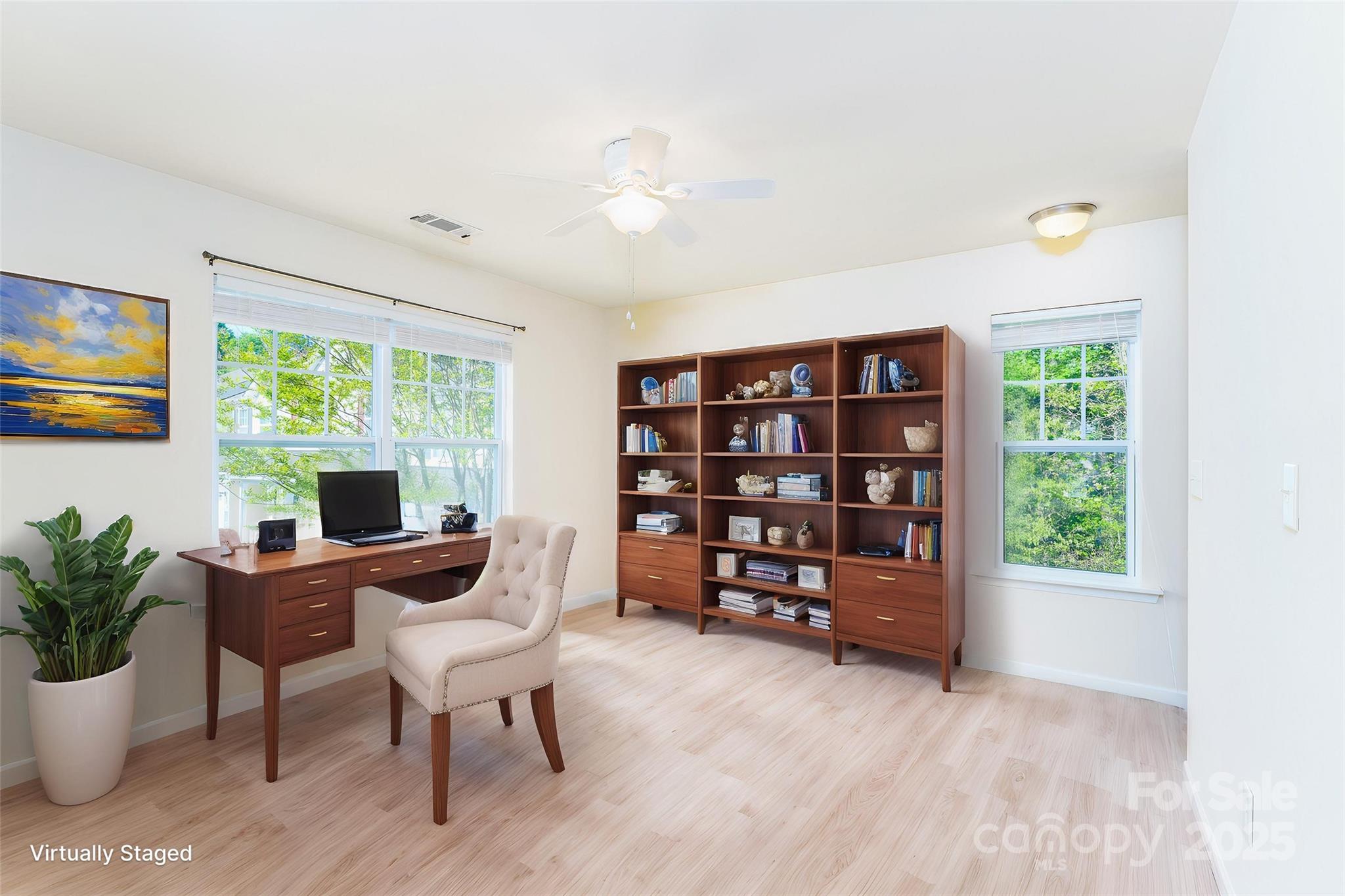 162 Limerick Road, Unit C Mooresville, NC 28115 - Photo 16 of 45 a view of a workspace with furniture and a potted plant