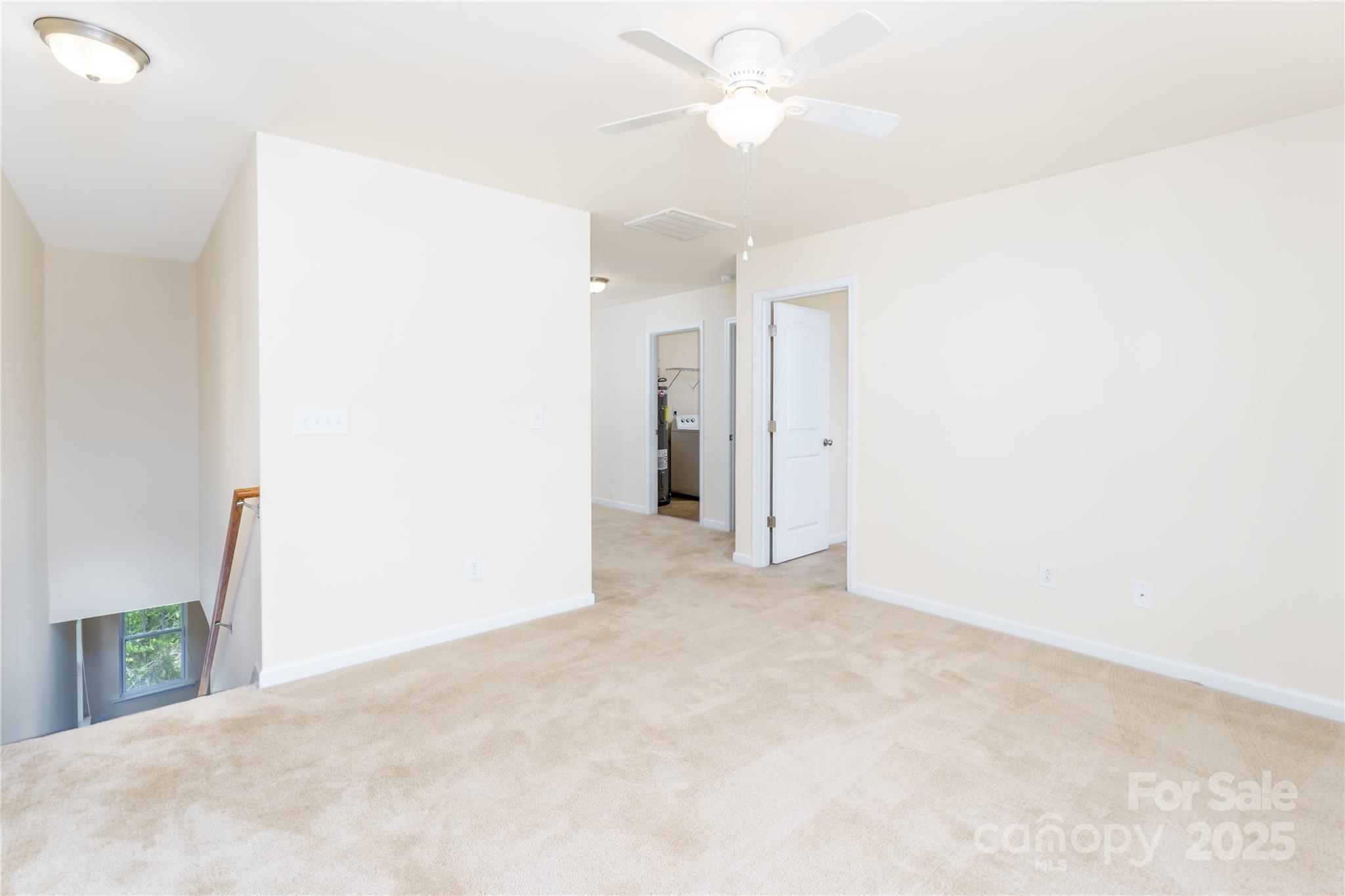 162 Limerick Road, Unit C Mooresville, NC 28115 - Photo 17 of 45 a view of an empty room with a ceiling fan