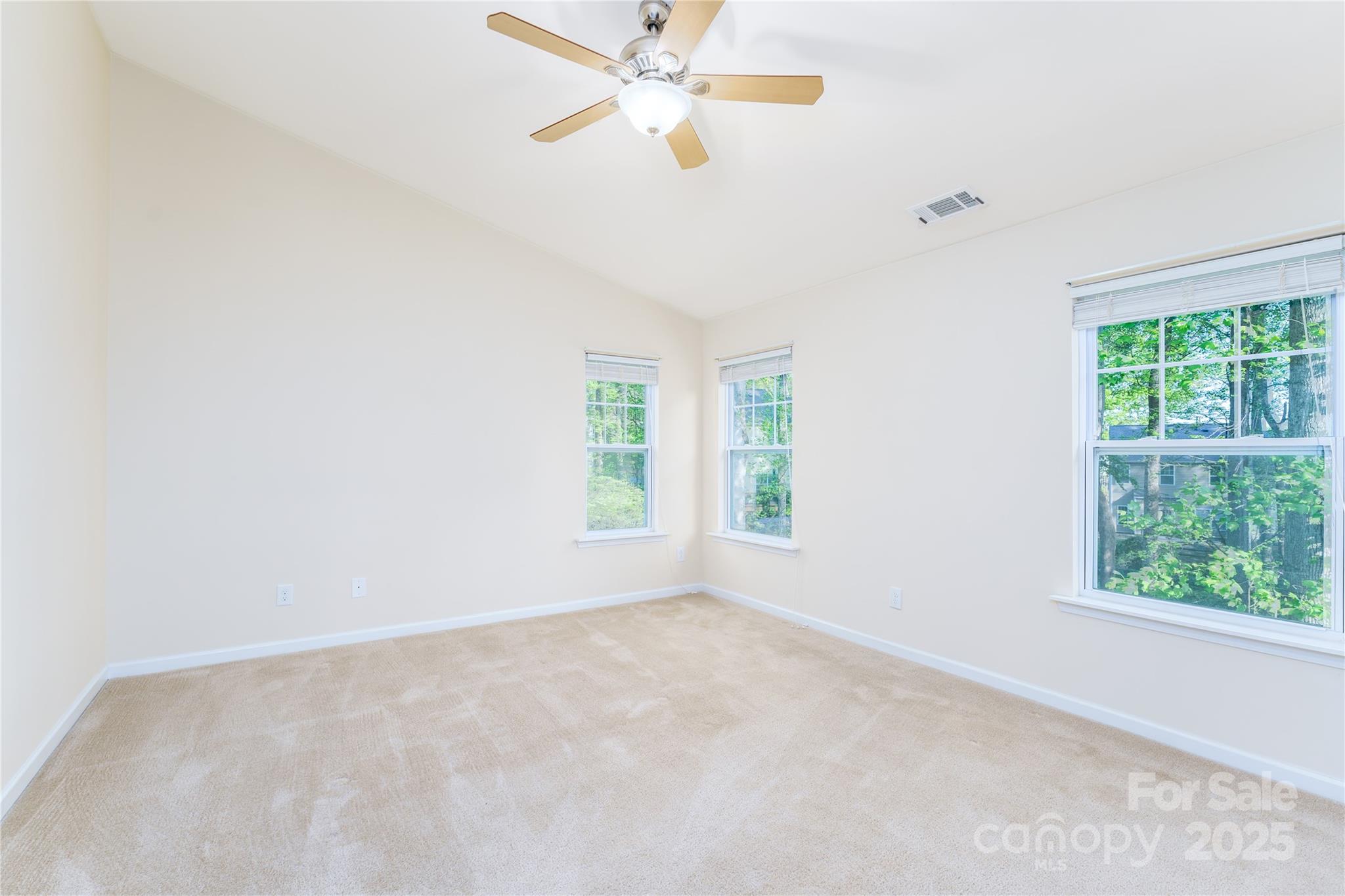 162 Limerick Road, Unit C Mooresville, NC 28115 - Photo 18 of 45 an empty room with a window and a fan