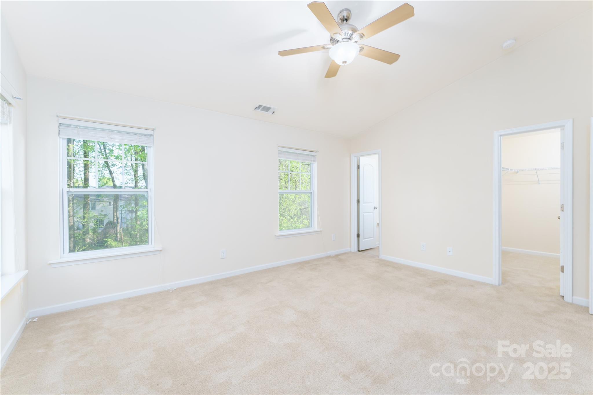 162 Limerick Road, Unit C Mooresville, NC 28115 - Photo 20 of 45 an empty room with windows and fan