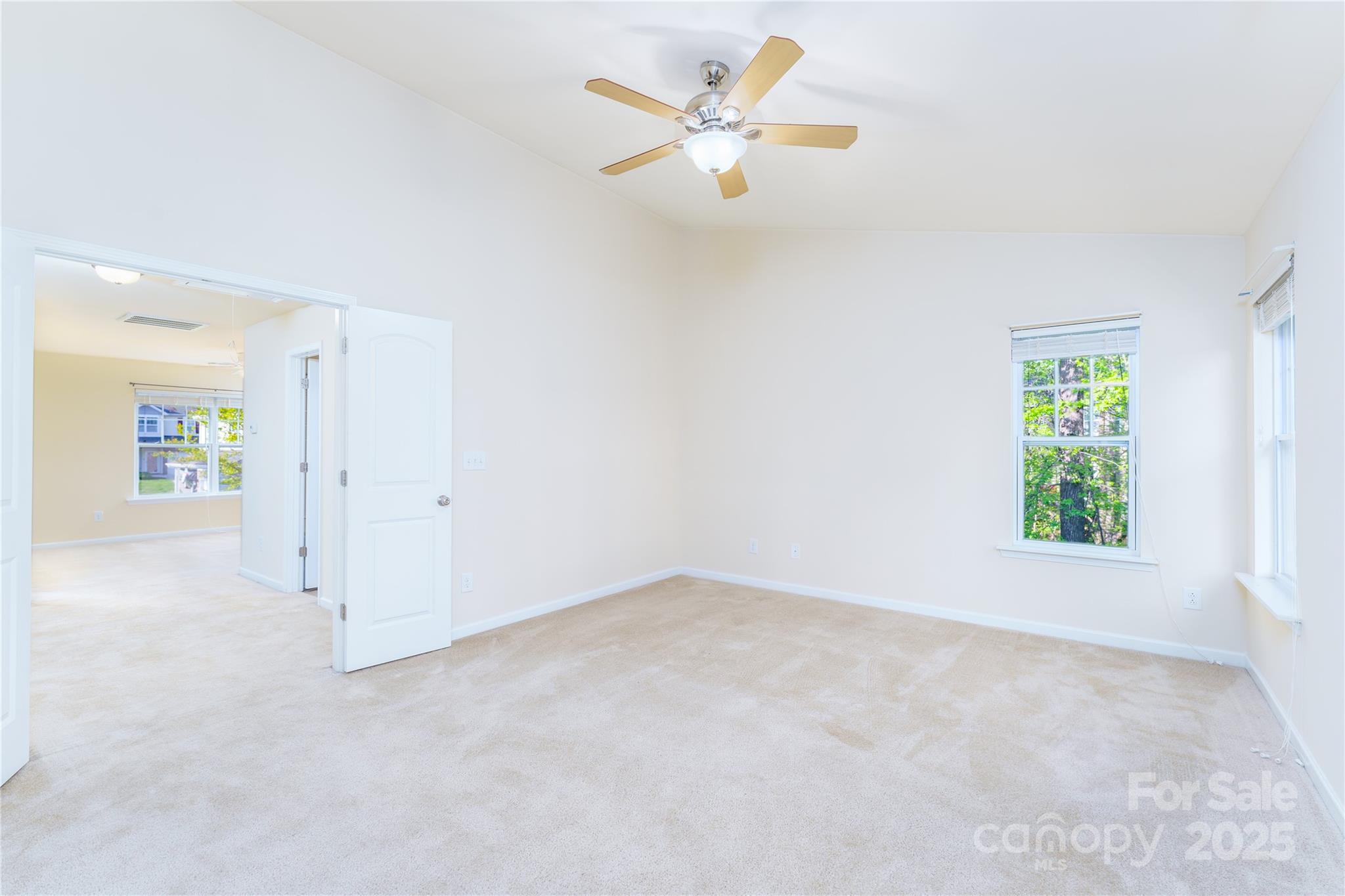 162 Limerick Road, Unit C Mooresville, NC 28115 - Photo 21 of 45 an empty room with a window and a ceiling fan