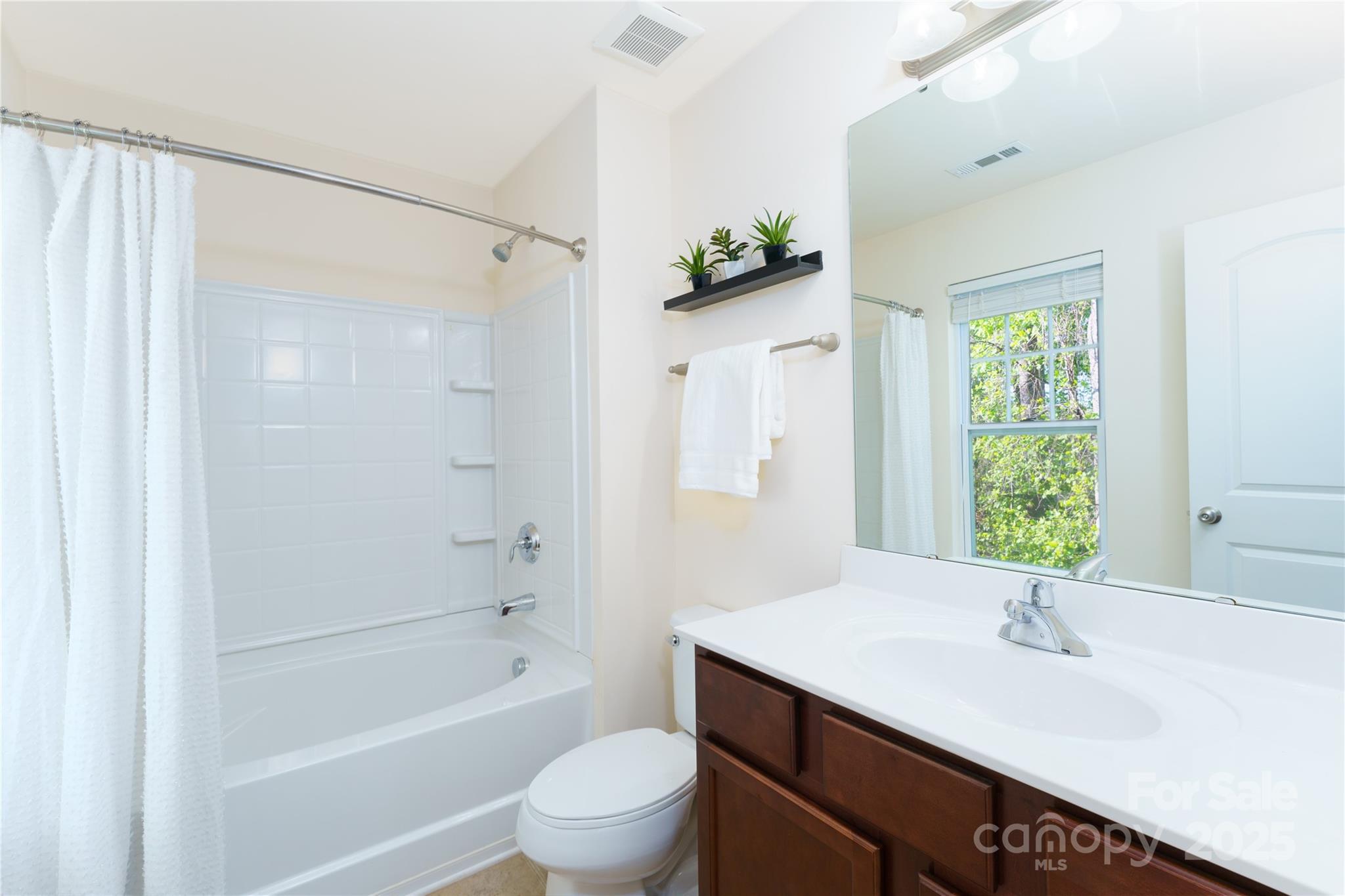 162 Limerick Road, Unit C Mooresville, NC 28115 - Photo 22 of 45 a bathroom with a granite countertop sink a toilet and shower