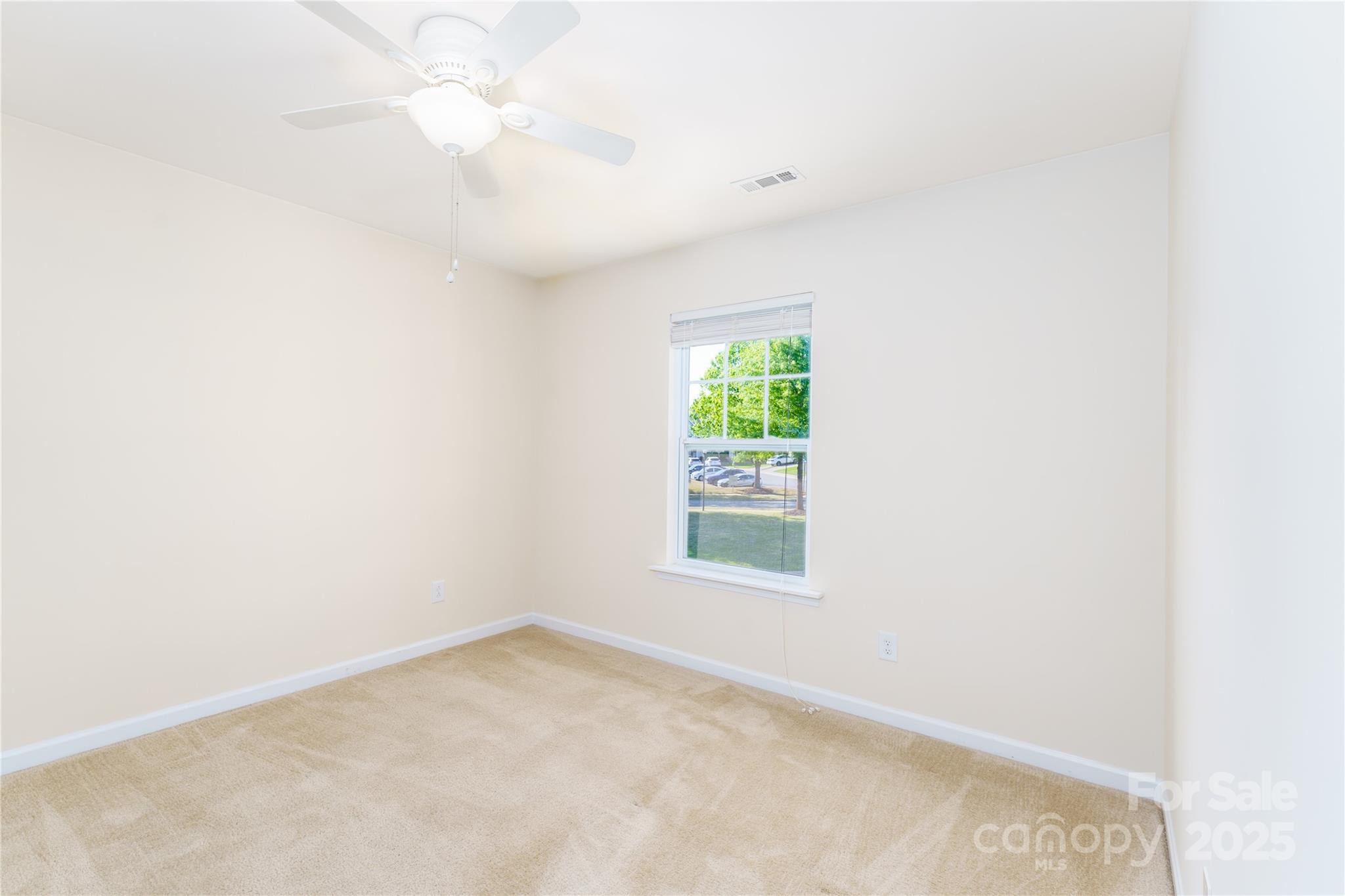 162 Limerick Road, Unit C Mooresville, NC 28115 - Photo 24 of 45 an empty room with a window and a fan