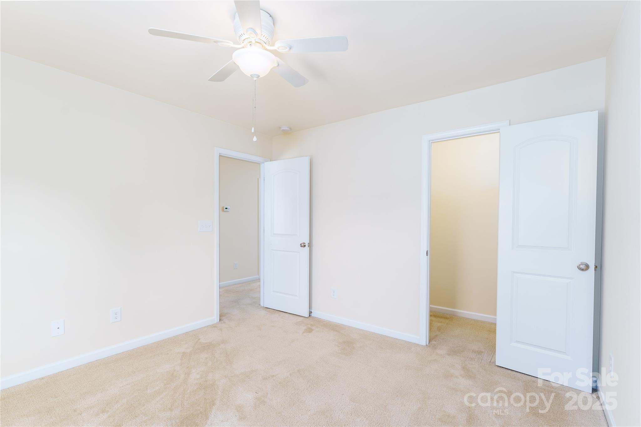 162 Limerick Road, Unit C Mooresville, NC 28115 - Photo 25 of 45 an empty room with a ceiling fan and a window