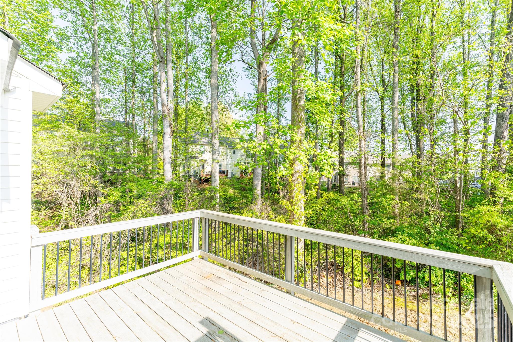 162 Limerick Road, Unit C Mooresville, NC 28115 - Photo 3 of 45 a view of a balcony with wooden floor and fence