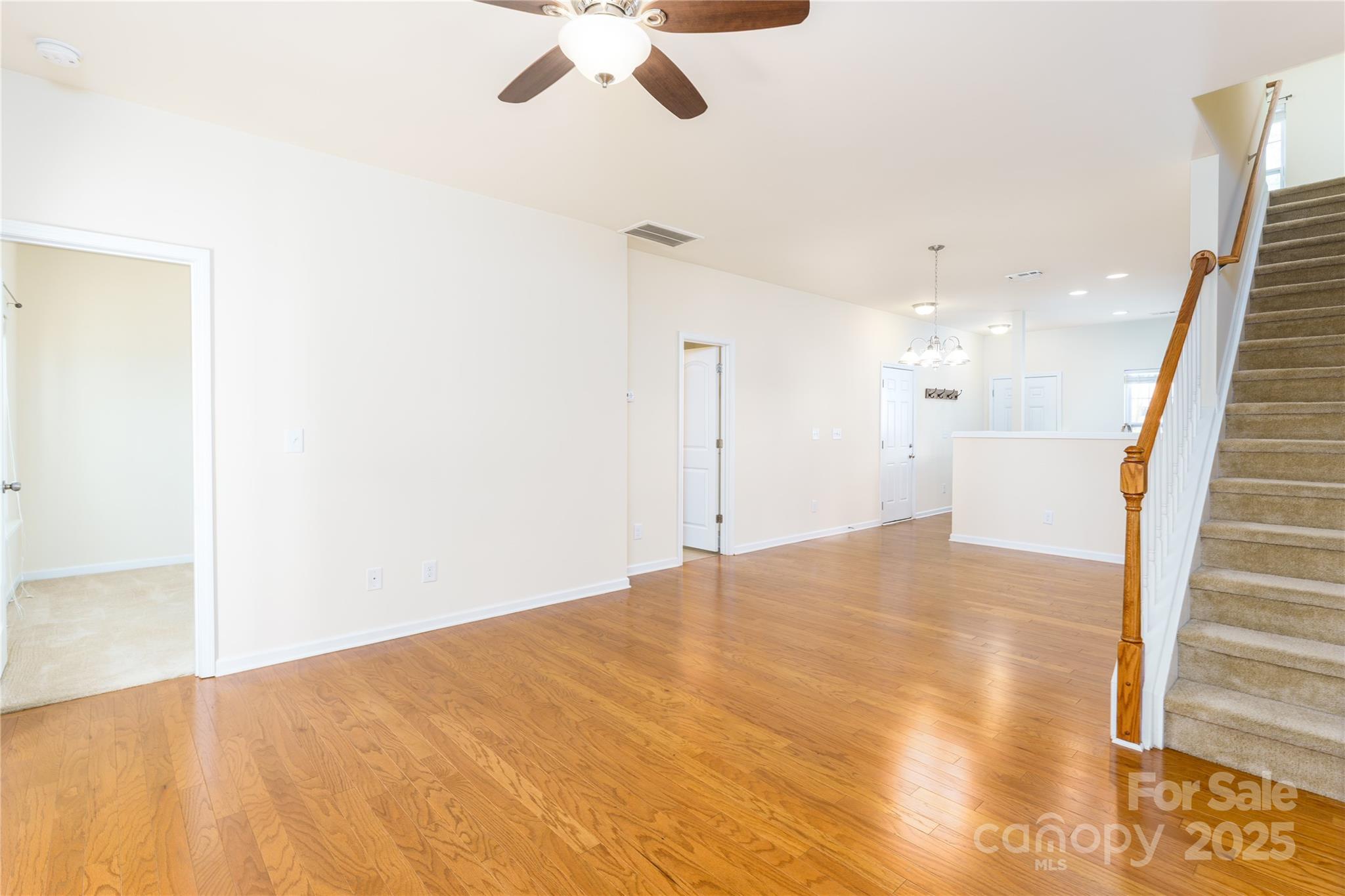 162 Limerick Road, Unit C Mooresville, NC 28115 - Photo 10 of 45 a view of an empty room with a chandelier fan