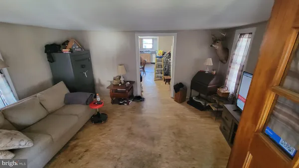 a living room with furniture a couch and a piano