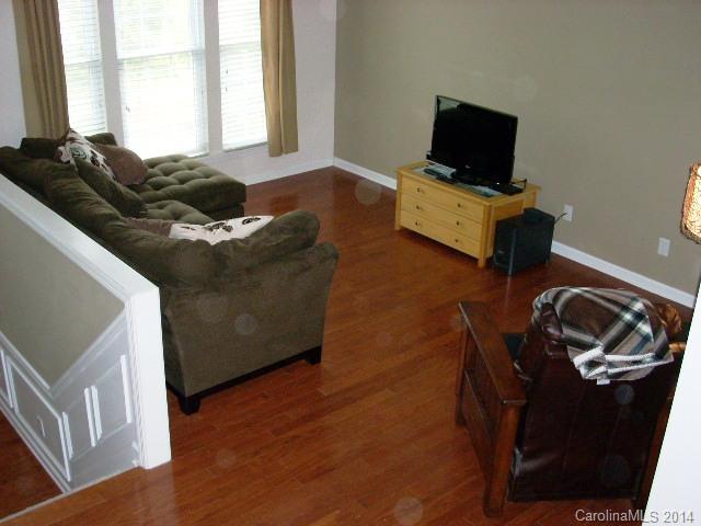 923 Lyndley Drive, Unit 75 Fort Mill, SC 29708 - Photo 4 of 12 a living room with furniture and a flat screen tv