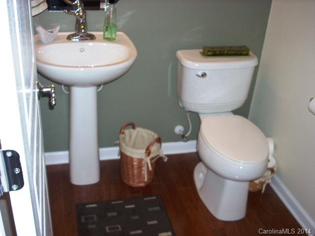 923 Lyndley Drive, Unit 75 Fort Mill, SC 29708 - Photo 7 of 12 a bathroom with a toilet sink and mirror