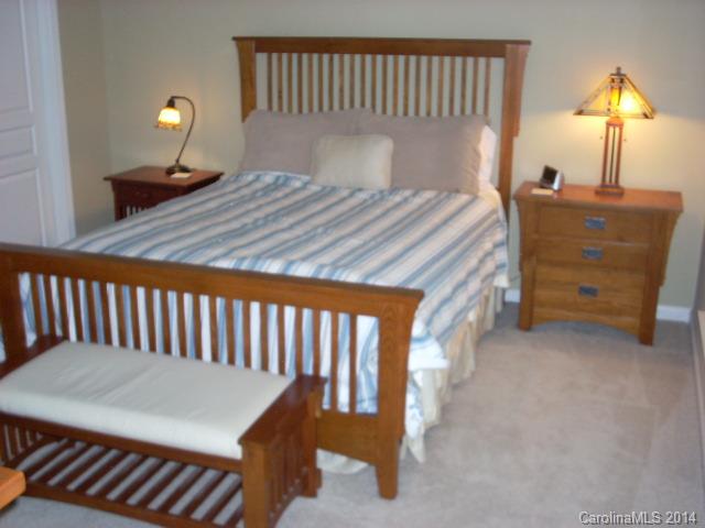 923 Lyndley Drive, Unit 75 Fort Mill, SC 29708 - Photo 9 of 12 a bedroom with a bed and a lamp