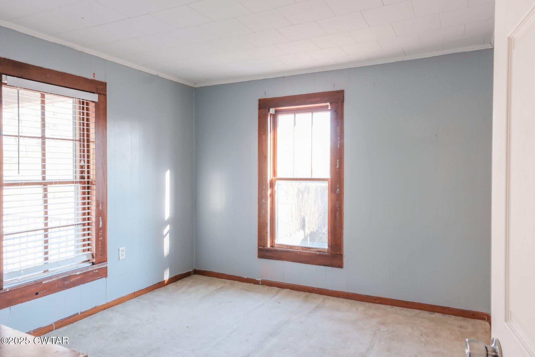 305 Phelps Street Gleason, TN 38229 - Photo 18 of 28 an empty room with windows
