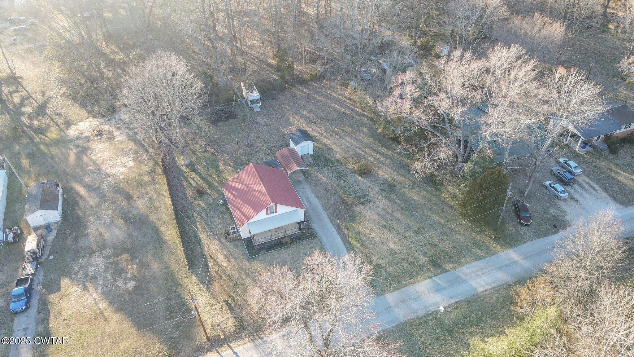 305 Phelps Street Gleason, TN 38229 - Photo 2 of 28 a view of a backyard of a house