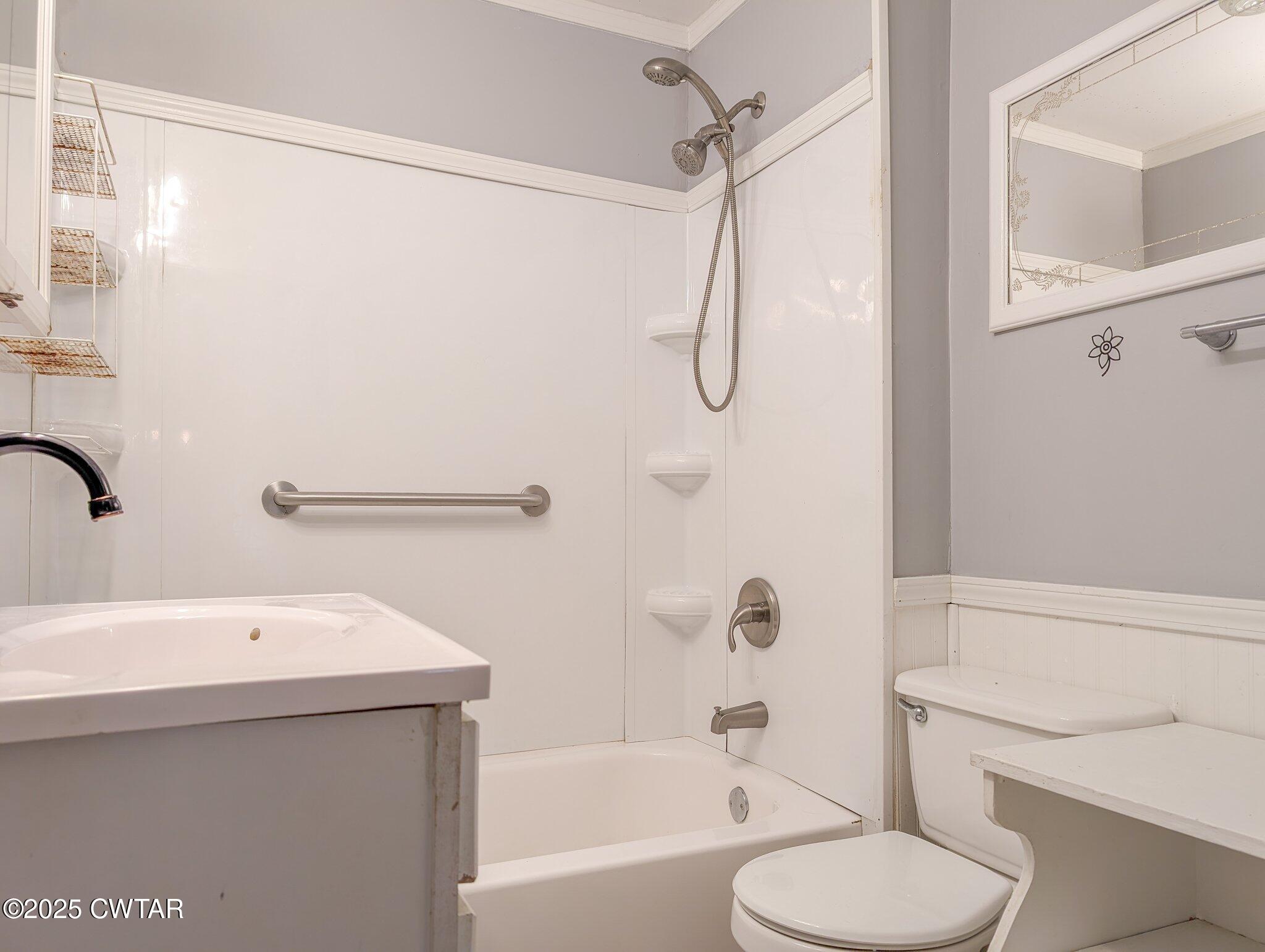 305 Phelps Street Gleason, TN 38229 - Photo 26 of 28 a bathroom with a sink toilet and shower