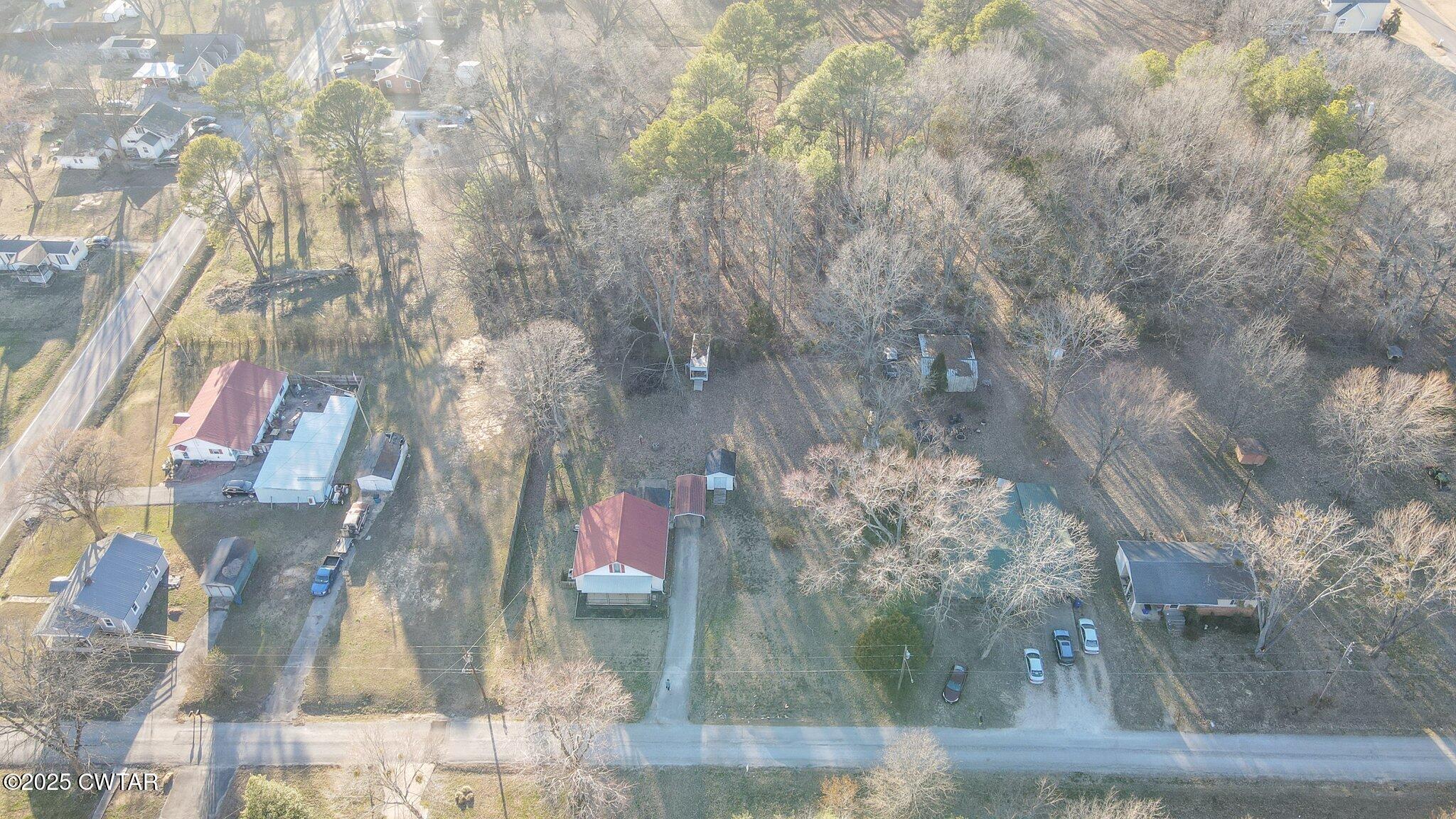 305 Phelps Street Gleason, TN 38229 - Photo 3 of 28 a vase of flowers sitting on a table
