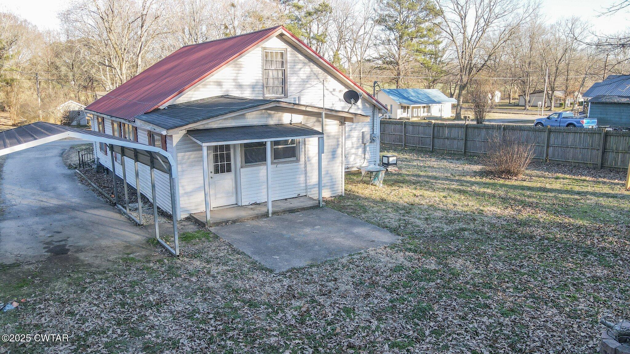 305 Phelps Street Gleason, TN 38229 - Photo 5 of 28 a view of a house with a yard