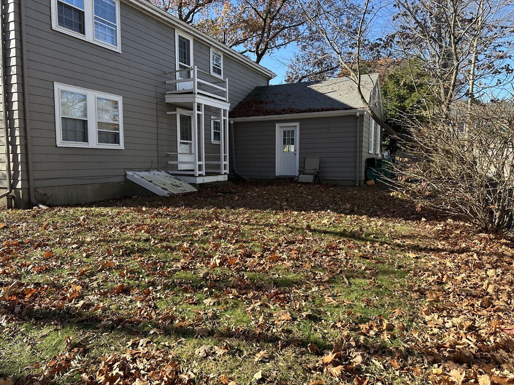 12 Cloelia Terrace, Unit 12 Newton, MA 02460 - Photo 8 of 9 a front view of a house with a garden