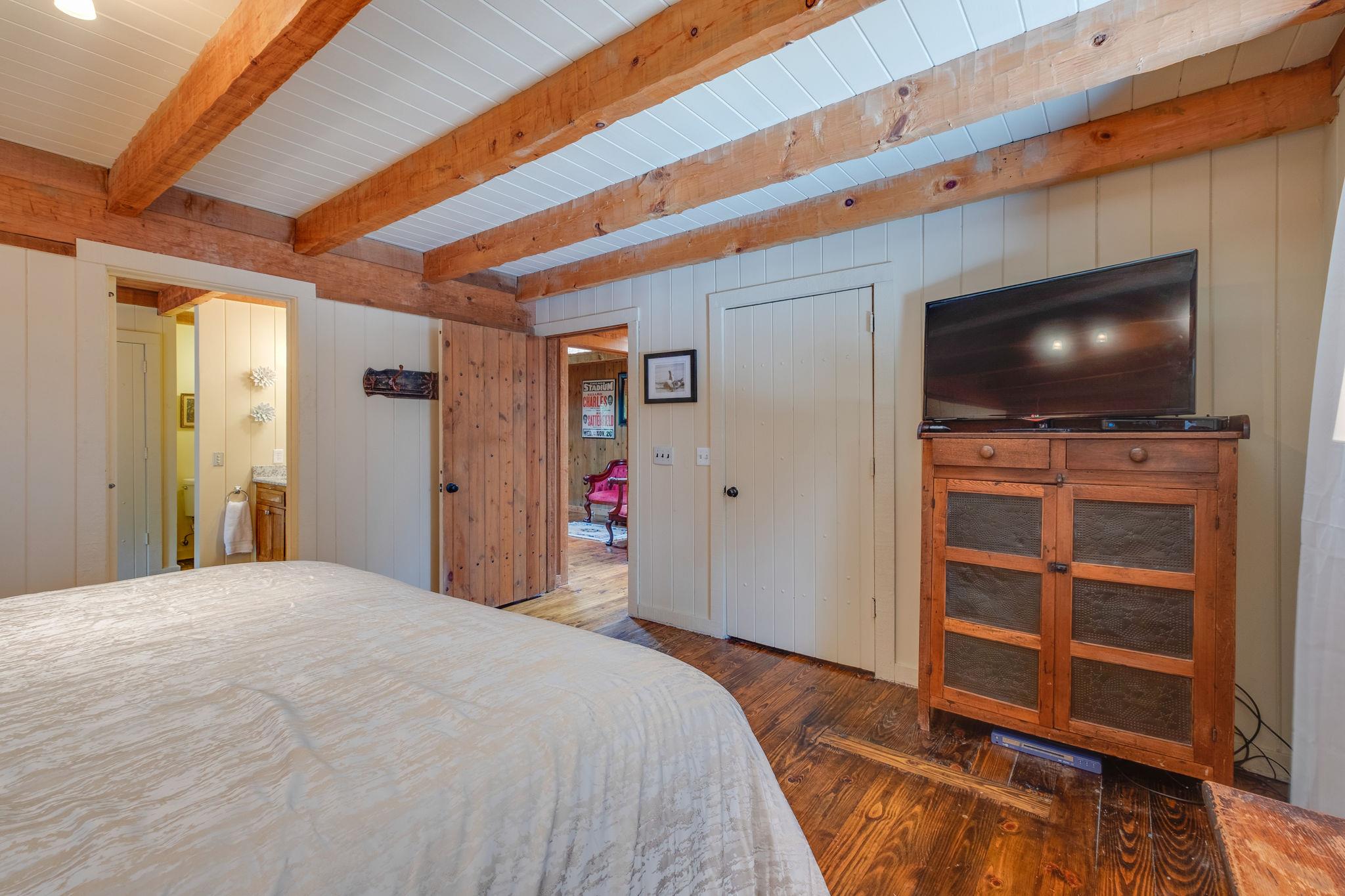 3360 Sweeney Hollow Road Franklin, TN 37064 - Photo 13 of 30 a bedroom with a bed and a flat screen tv