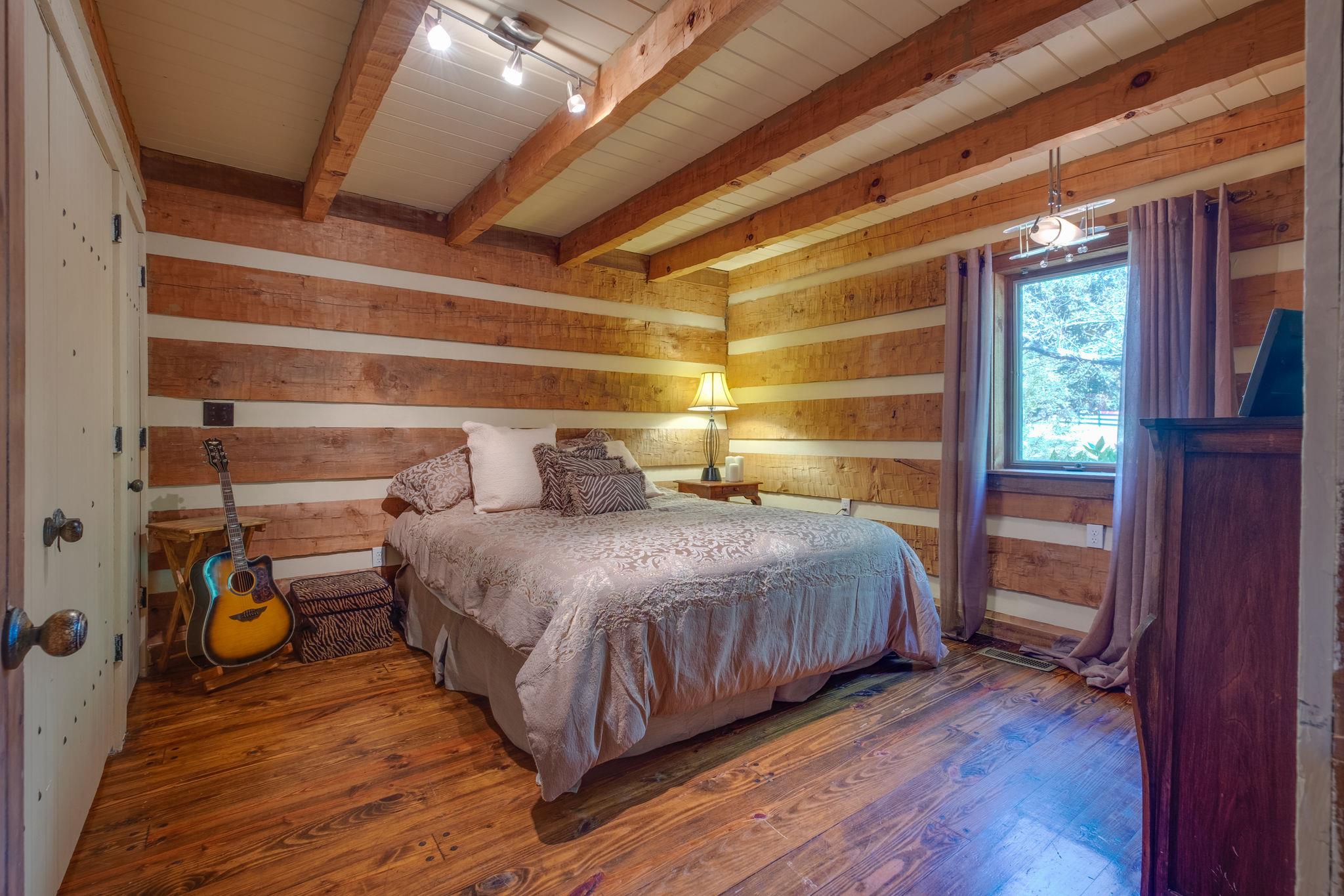 3360 Sweeney Hollow Road Franklin, TN 37064 - Photo 17 of 30 a bedroom with a bed and wooden floor