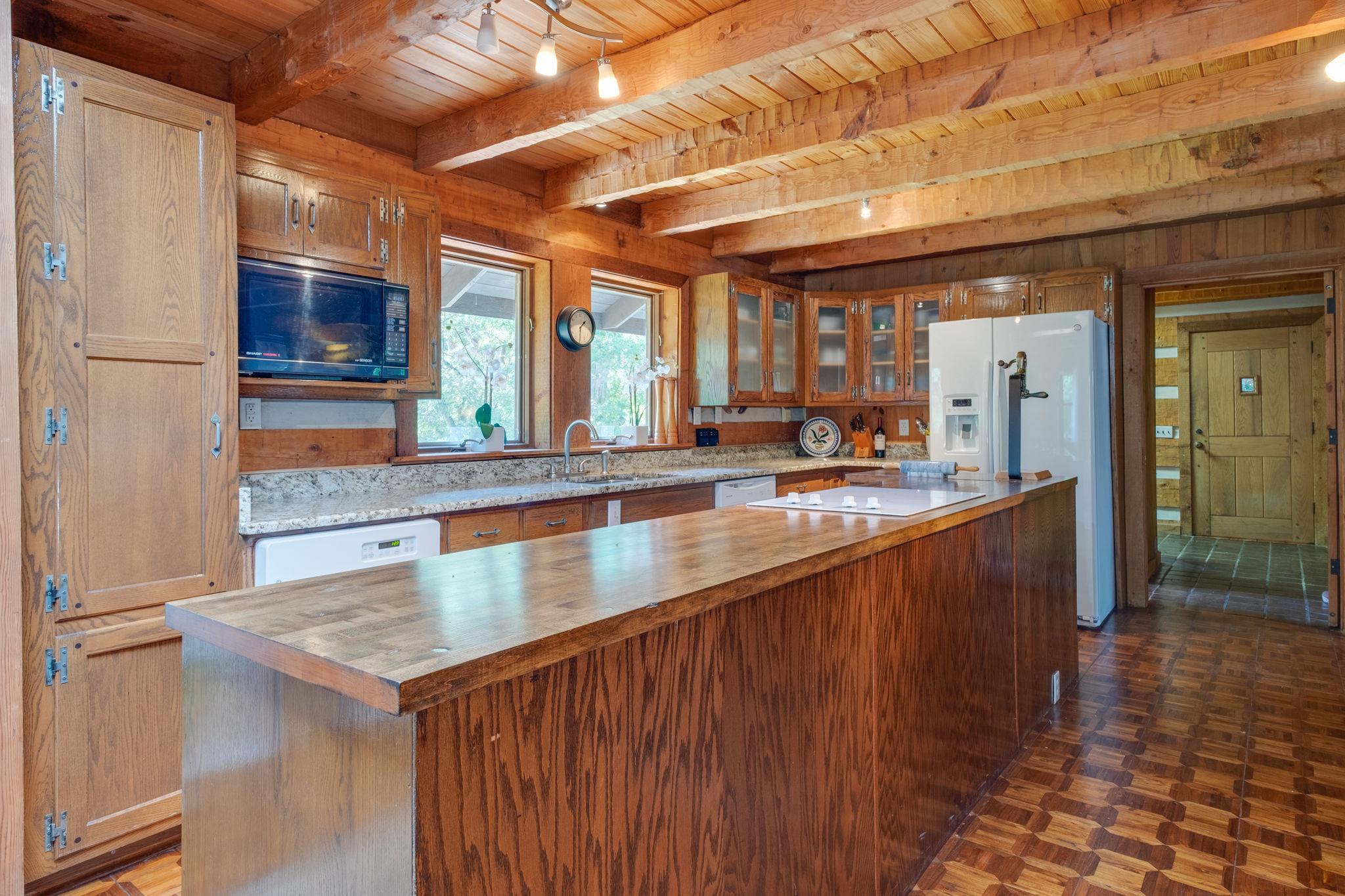 3360 Sweeney Hollow Road Franklin, TN 37064 - Photo 9 of 30 a kitchen with stainless steel appliances granite countertop a sink and a stove