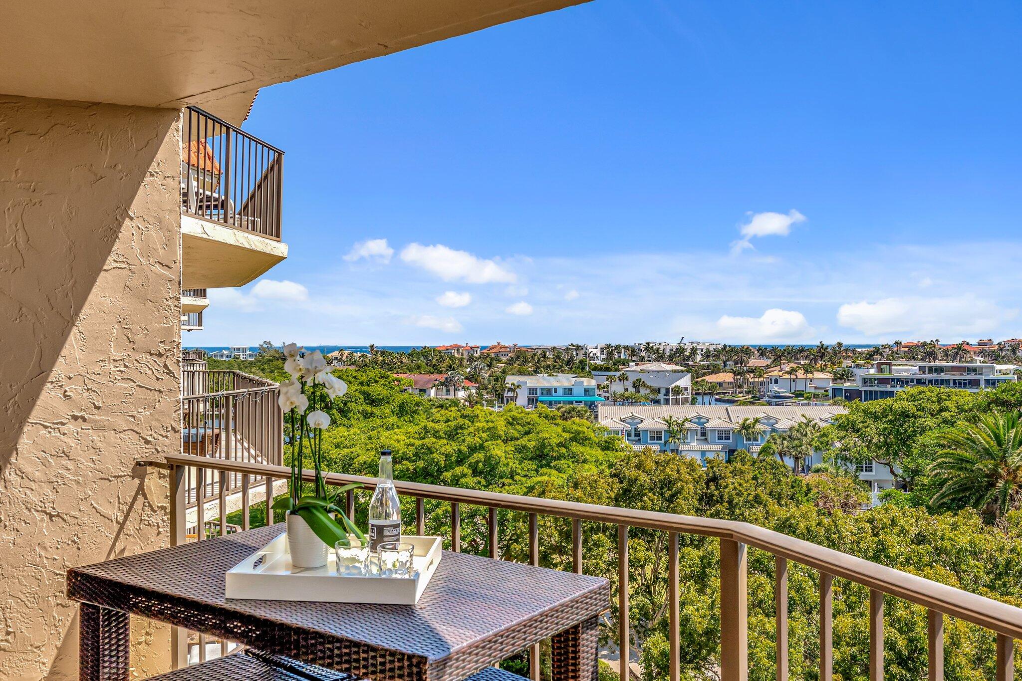 859 Jeffery Street, Unit 7030 Boca Raton, FL 33487 - Photo 14 of 53 a view of a balcony with two chairs and a table