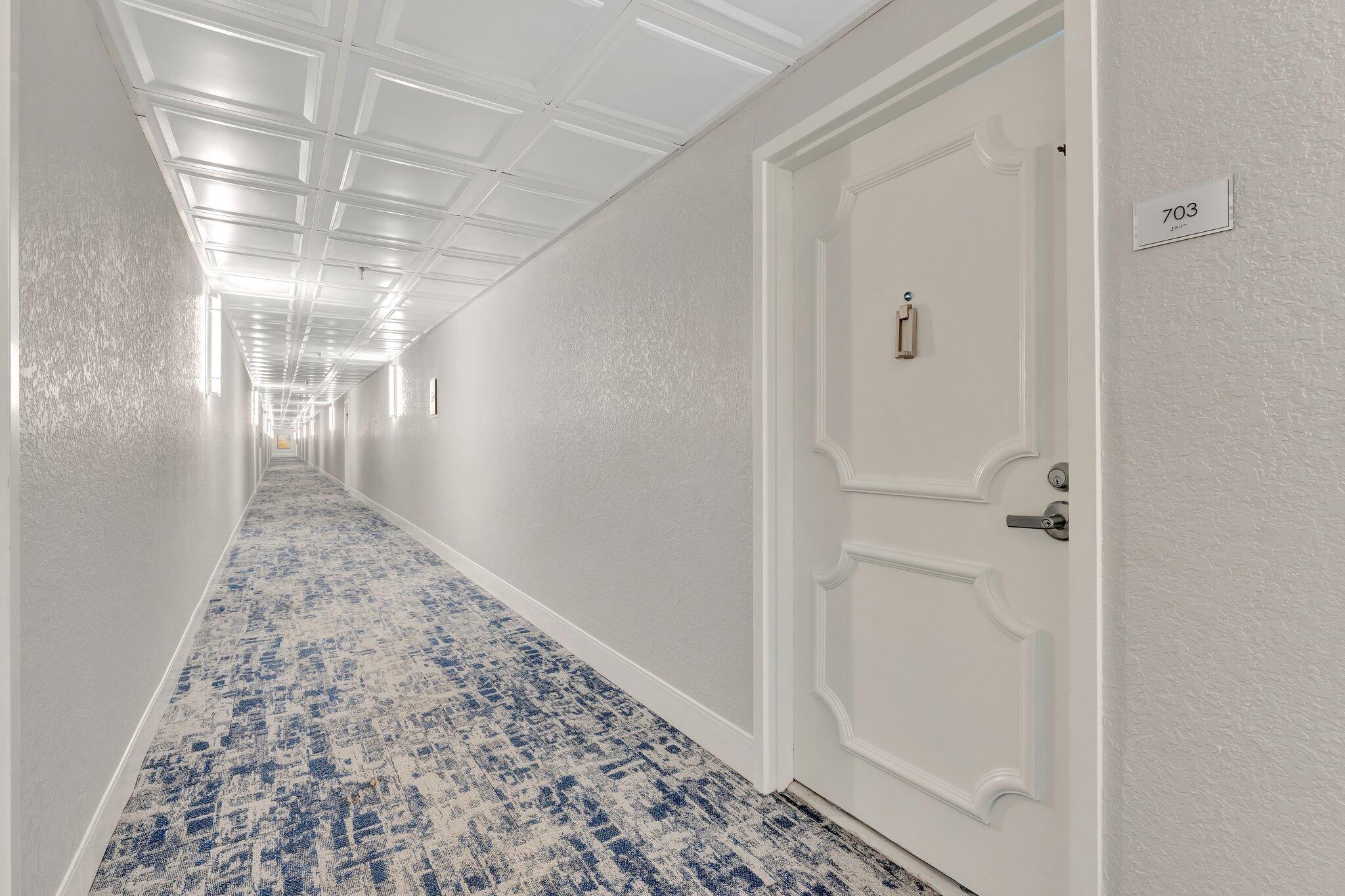 859 Jeffery Street, Unit 7030 Boca Raton, FL 33487 - Photo 24 of 53 a view of a hallway
