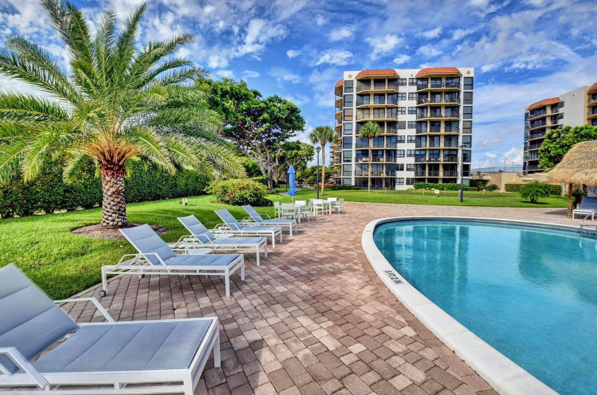 859 Jeffery Street, Unit 7030 Boca Raton, FL 33487 - Photo 30 of 53 a view of a swimming pool with a patio