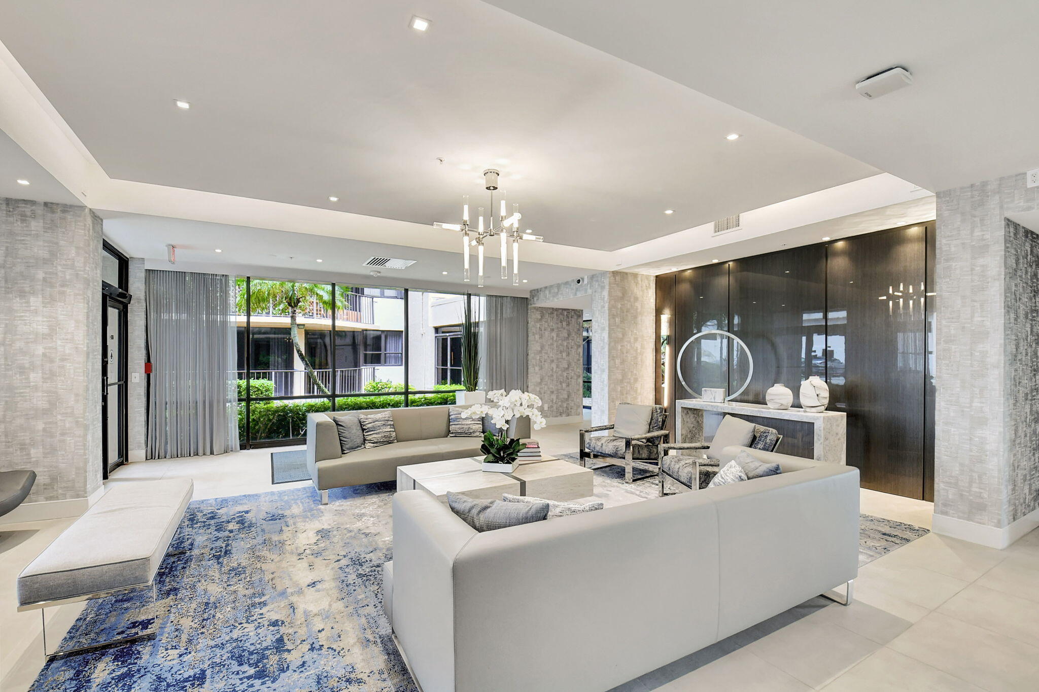 859 Jeffery Street, Unit 7030 Boca Raton, FL 33487 - Photo 37 of 53 a view of living room with furniture and chandelier
