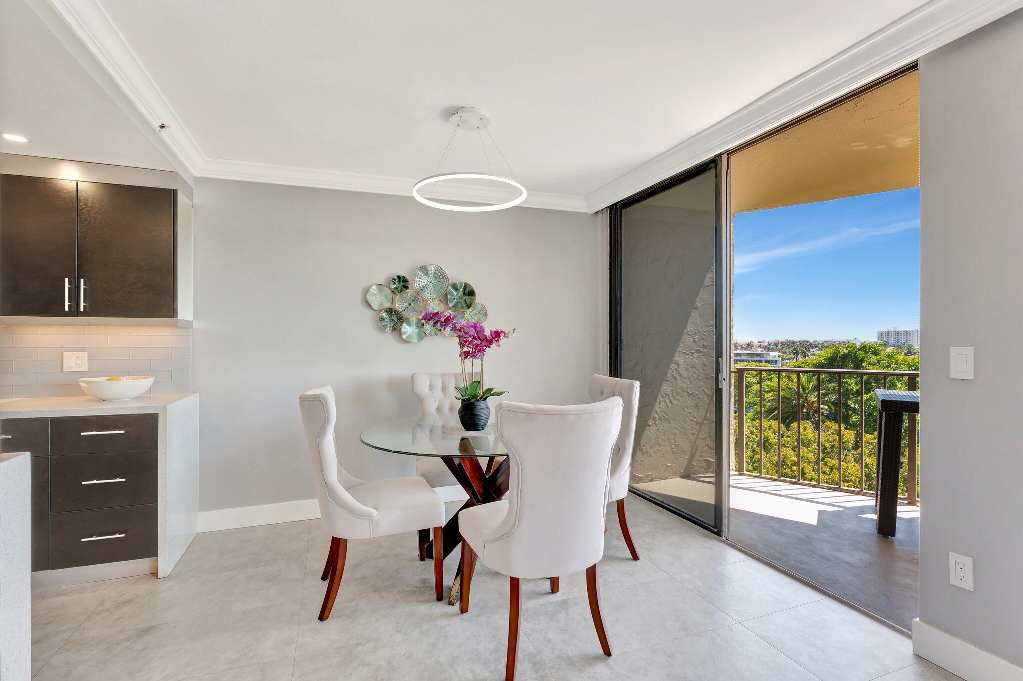859 Jeffery Street, Unit 7030 Boca Raton, FL 33487 - Photo 4 of 53 a view of a dining room with furniture and a potted plant