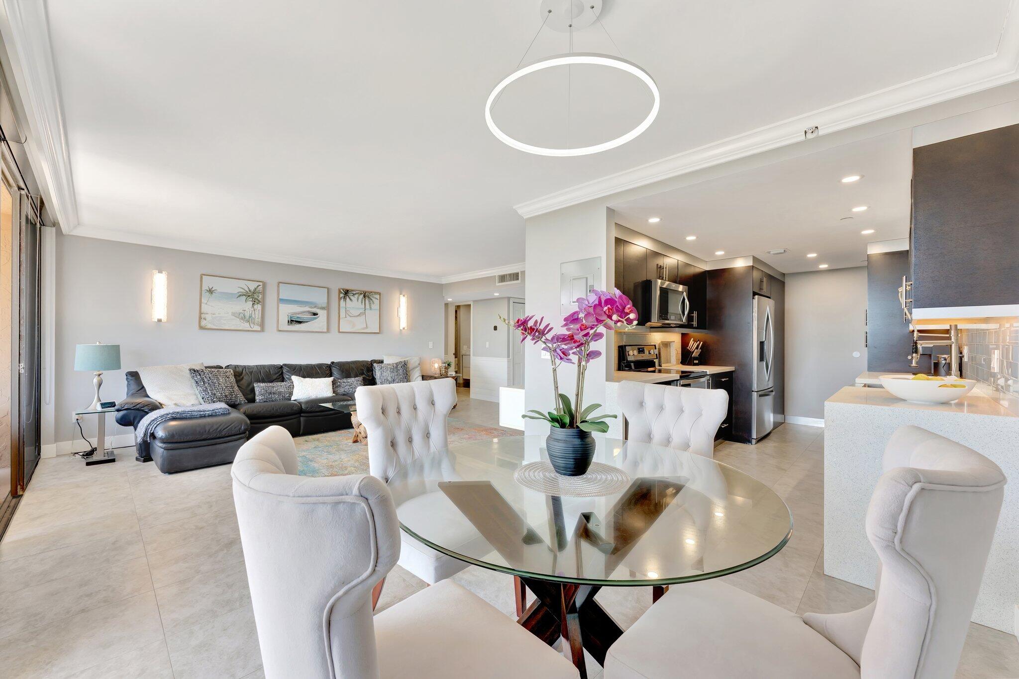 859 Jeffery Street, Unit 7030 Boca Raton, FL 33487 - Photo 9 of 53 a dining room with furniture and wooden floor