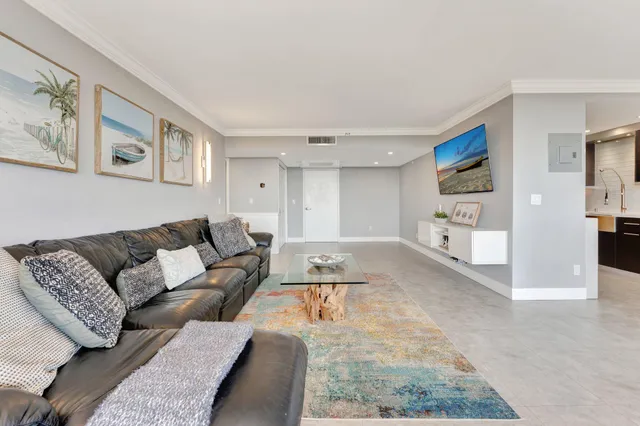 a living room with furniture and a rug