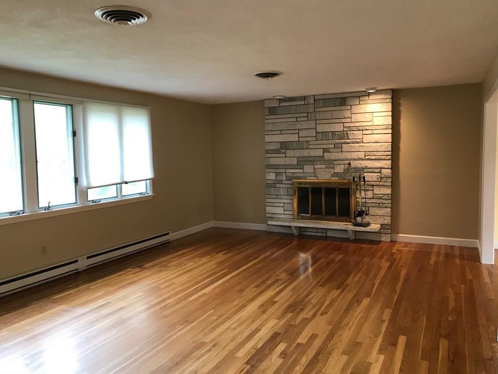 8 Idylwilde Road Lexington, MA 02421 - Photo 12 of 27 a view of an empty room with wooden floor and a window