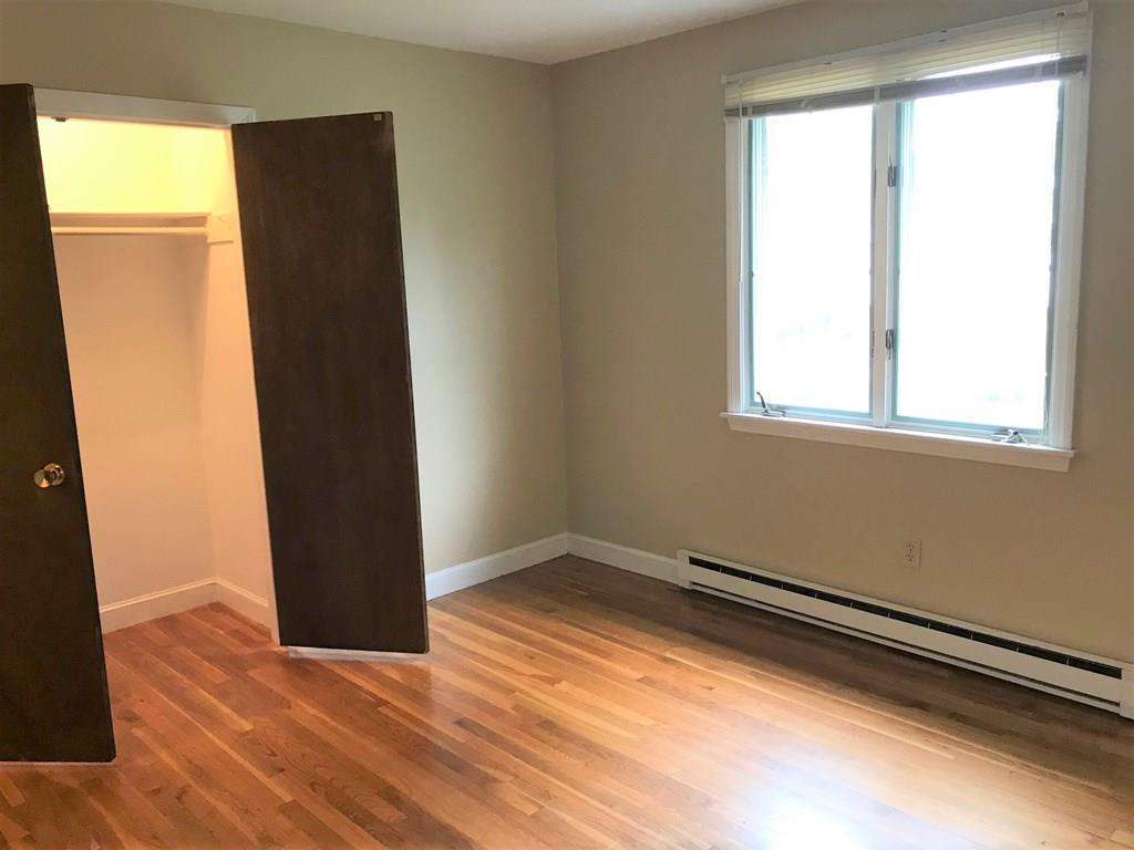 8 Idylwilde Road Lexington, MA 02421 - Photo 15 of 27 a view of an empty room with wooden floor and a window