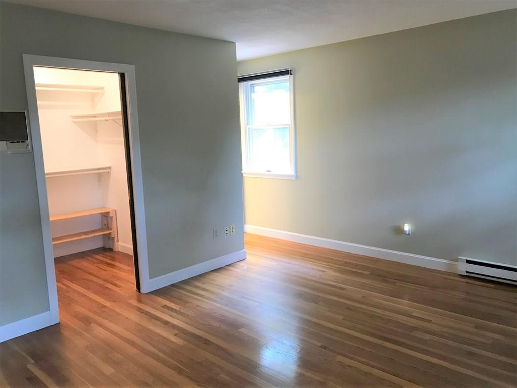 8 Idylwilde Road Lexington, MA 02421 - Photo 18 of 27 an empty room with wooden floor and windows