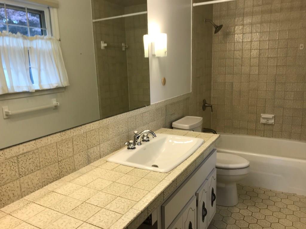 8 Idylwilde Road Lexington, MA 02421 - Photo 20 of 27 a bathroom with a sink a toilet and shower