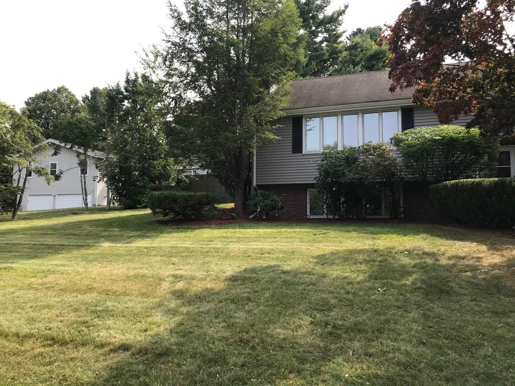 8 Idylwilde Road Lexington, MA 02421 - Photo 4 of 27 a view of a house with a yard and a large tree