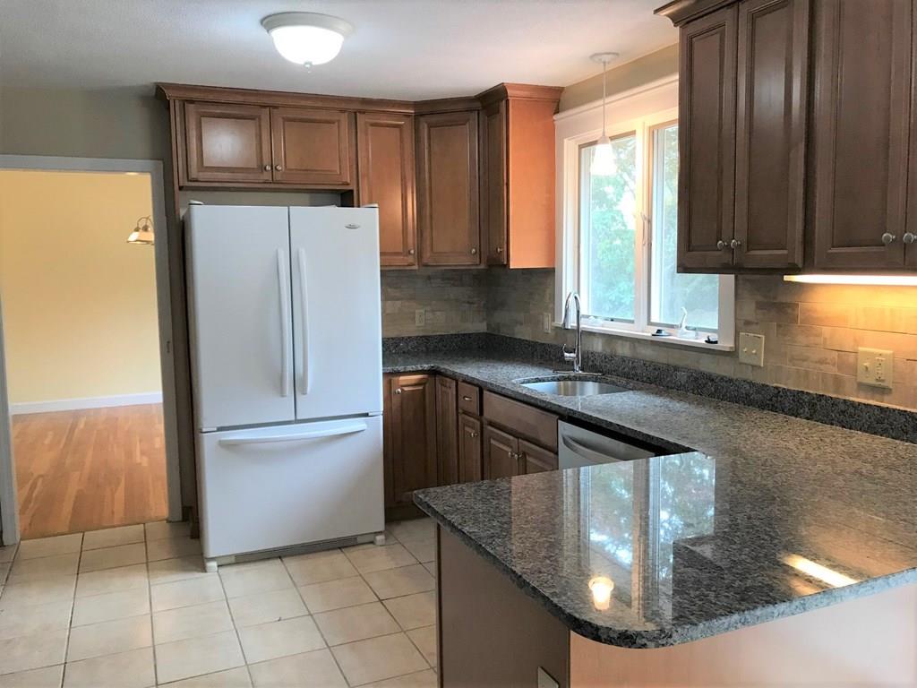 8 Idylwilde Road Lexington, MA 02421 - Photo 8 of 27 a kitchen with a refrigerator a sink and a stove